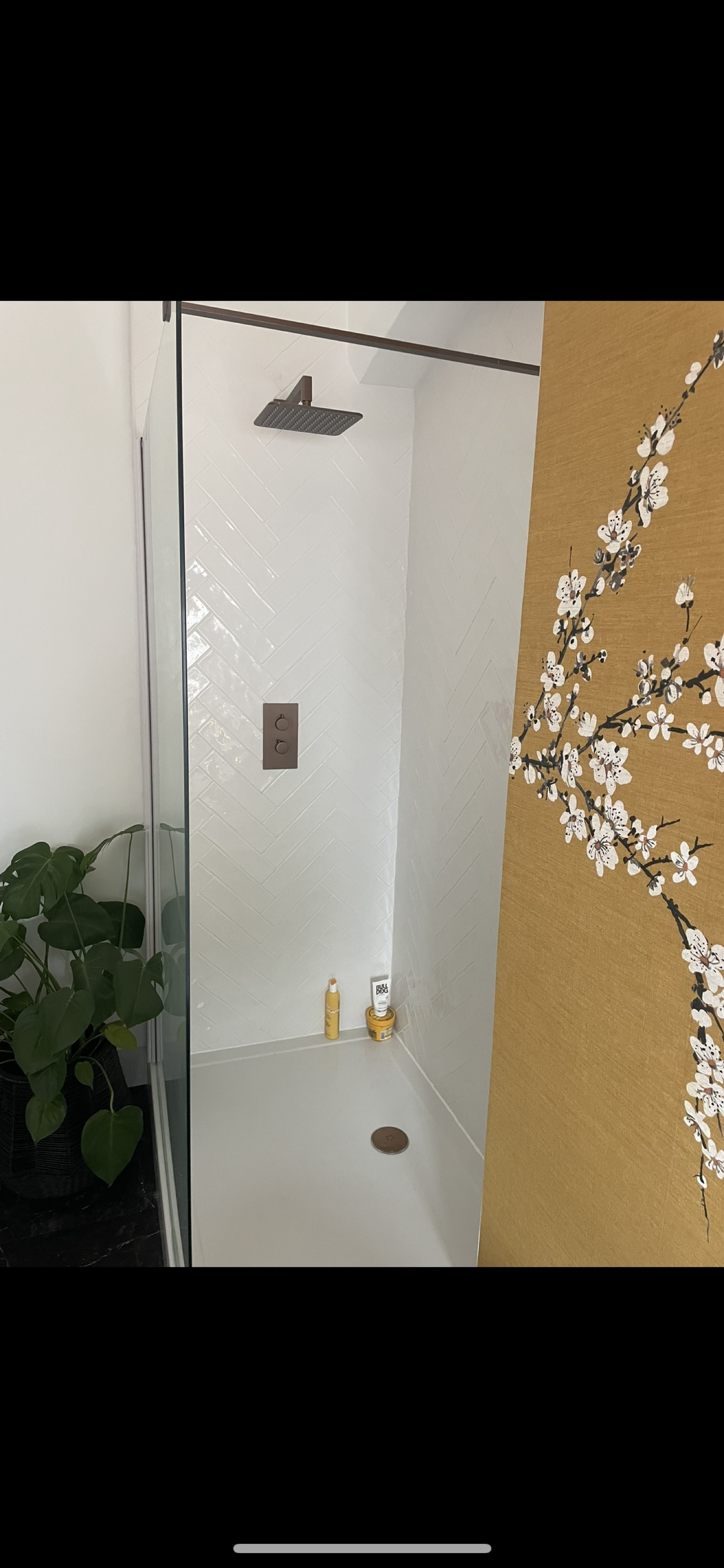 Walk-in shower with herringbone tiles