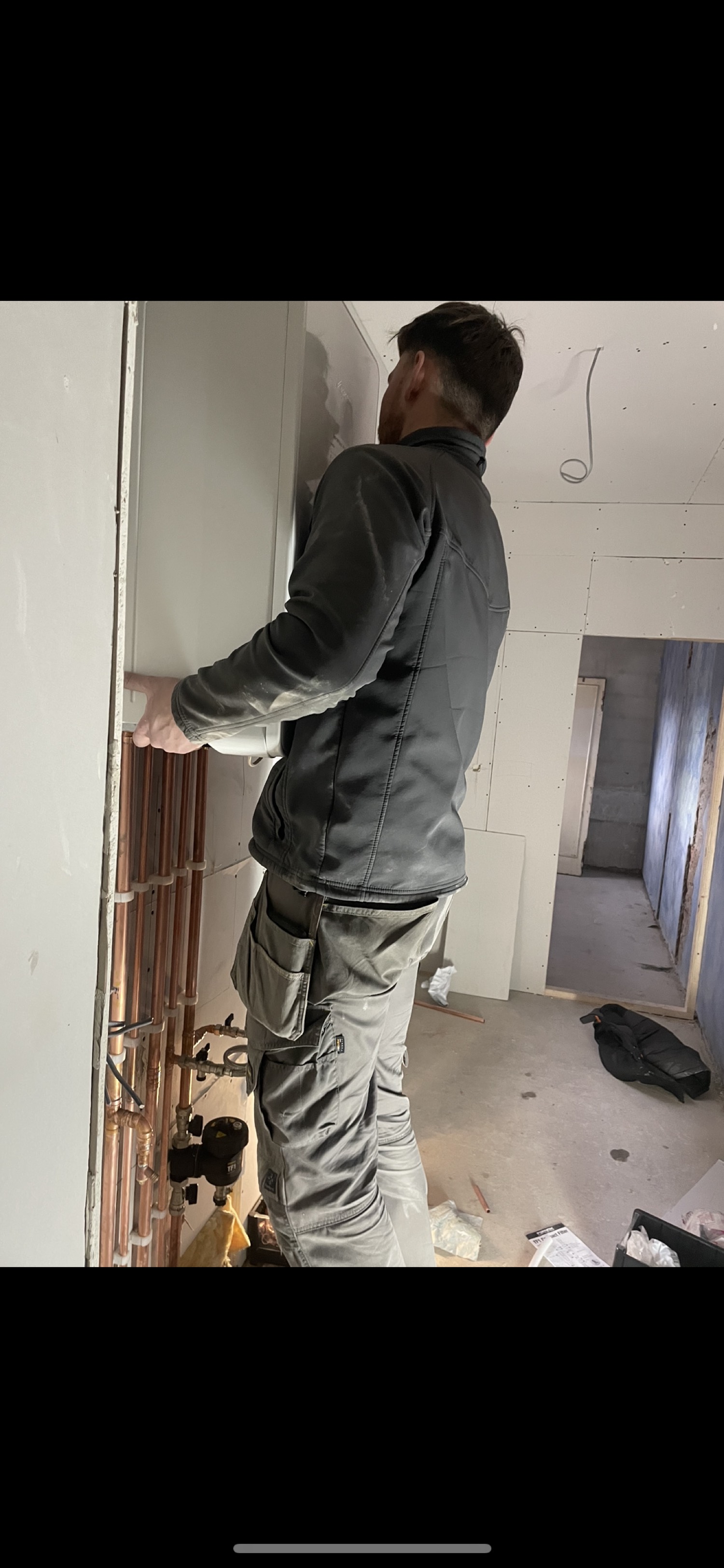 Lewis installing boiler