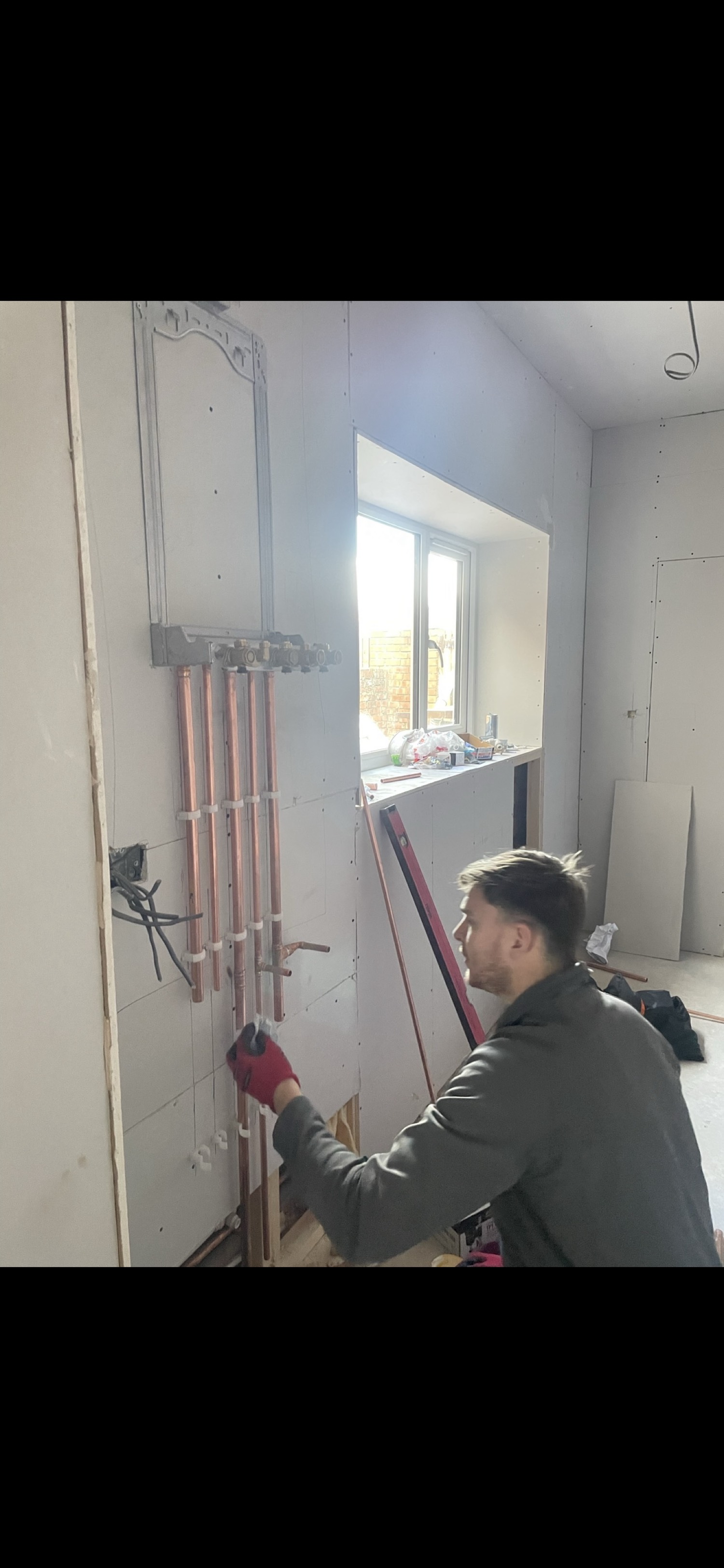 Lewis installing pipework